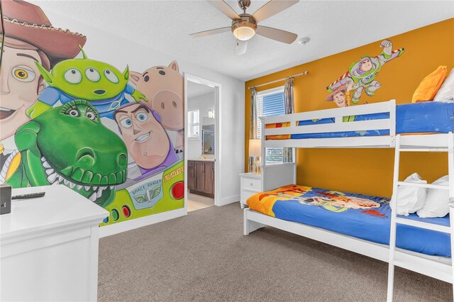 501 Burma St, Kissimmee, FL 34747 - bedroom with a ceiling fan, a textured ceiling, connected bathroom, carpet, and baseboards