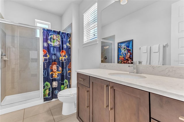 501 Burma St, Kissimmee, FL 34747 - full bathroom with vanity, tile patterned floors, toilet, and a stall shower