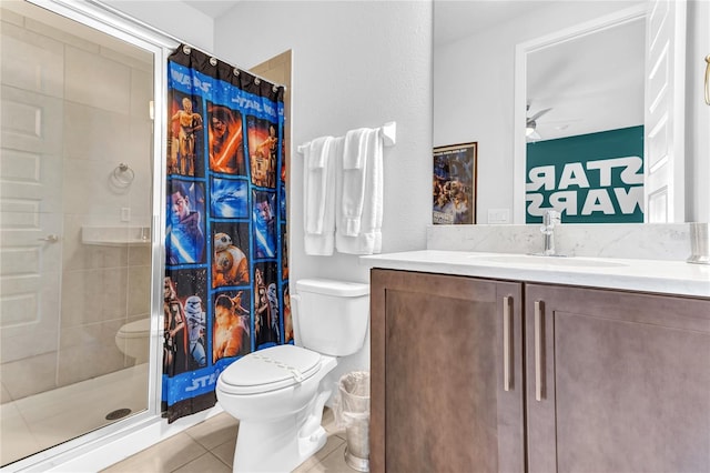 501 Burma St, Kissimmee, FL 34747 - bathroom featuring tile patterned floors, a stall shower, toilet, and vanity