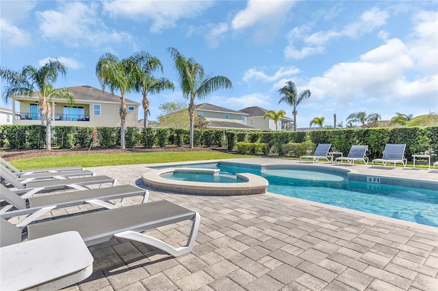 501 Burma St, Kissimmee, FL 34747 - view of pool with a patio area, fence, and a pool with connected hot tub