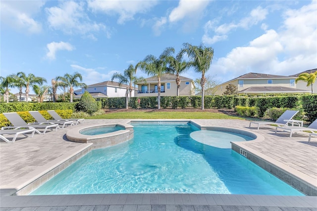 501 Burma St, Kissimmee, FL 34747 - view of swimming pool with a patio and a pool with connected hot tub