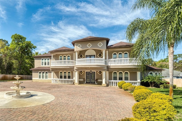 1984 Windermere Rd, Windermere, FL 34786 - rear view of property with french doors, a balcony, and stucco siding