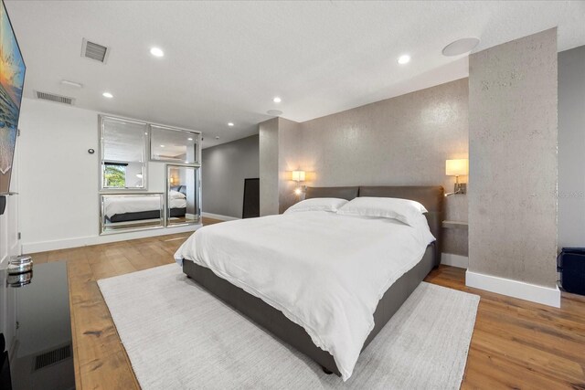 7841 Georgeann St, Winter Park, FL 32792 - bedroom with baseboards, wood finished floors, and recessed lighting