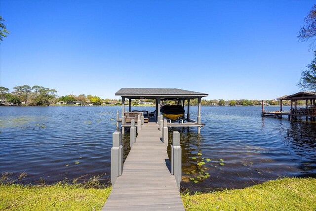 7841 Georgeann St, Winter Park, FL 32792 - dock area featuring boat lift and a water view