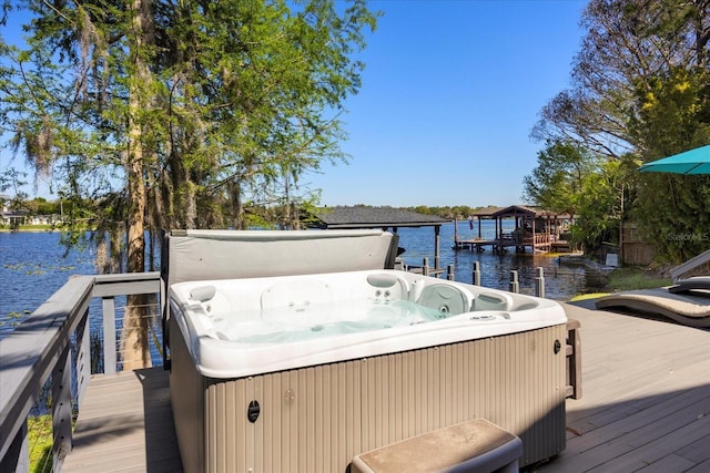 7841 Georgeann St, Winter Park, FL 32792 - dock area featuring a hot tub and a deck with water view