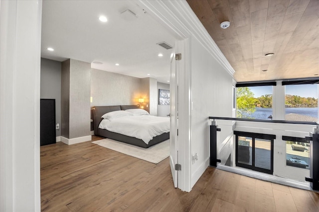 7841 Georgeann St, Winter Park, FL 32792 - bedroom featuring wood-type flooring, baseboards, and recessed lighting