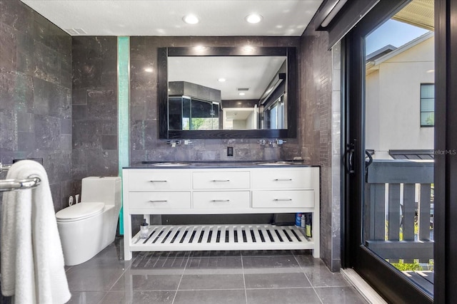 7841 Georgeann St, Winter Park, FL 32792 - full bath with toilet, double vanity, and tile patterned floors