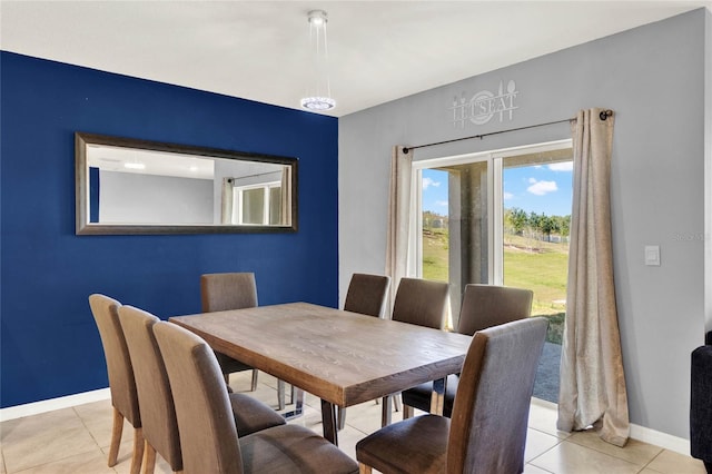 11207 Amber Ridge Dr, Zellwood, FL 32798 - dining space with baseboards and light tile patterned floors