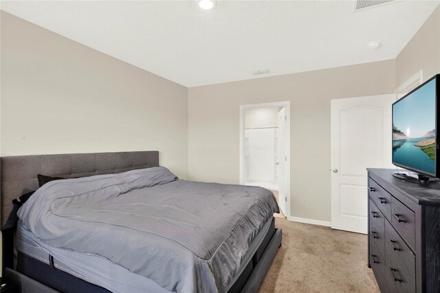 11207 Amber Ridge Dr, Zellwood, FL 32798 - bedroom featuring light carpet, baseboards, and visible vents