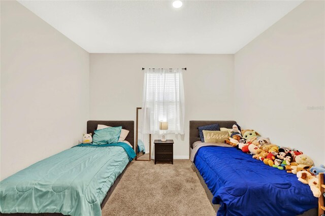 11207 Amber Ridge Dr, Zellwood, FL 32798 - bedroom featuring baseboards and carpet