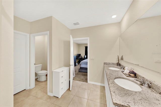 11207 Amber Ridge Dr, Zellwood, FL 32798 - bathroom featuring ensuite bathroom, toilet, tile patterned flooring, and a sink