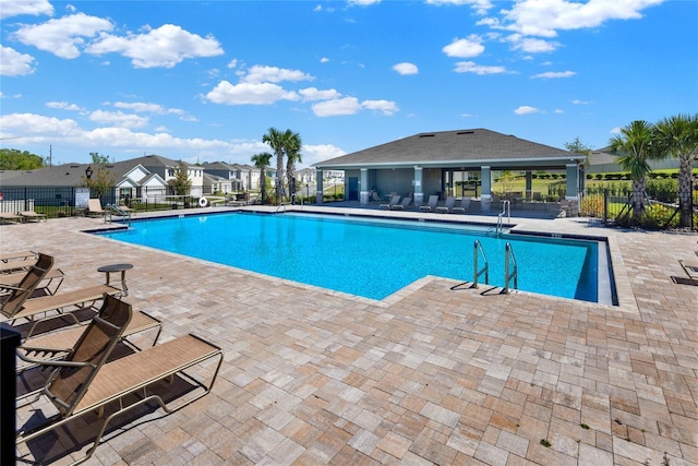 11207 Amber Ridge Dr, Zellwood, FL 32798 - community pool with fence and a patio