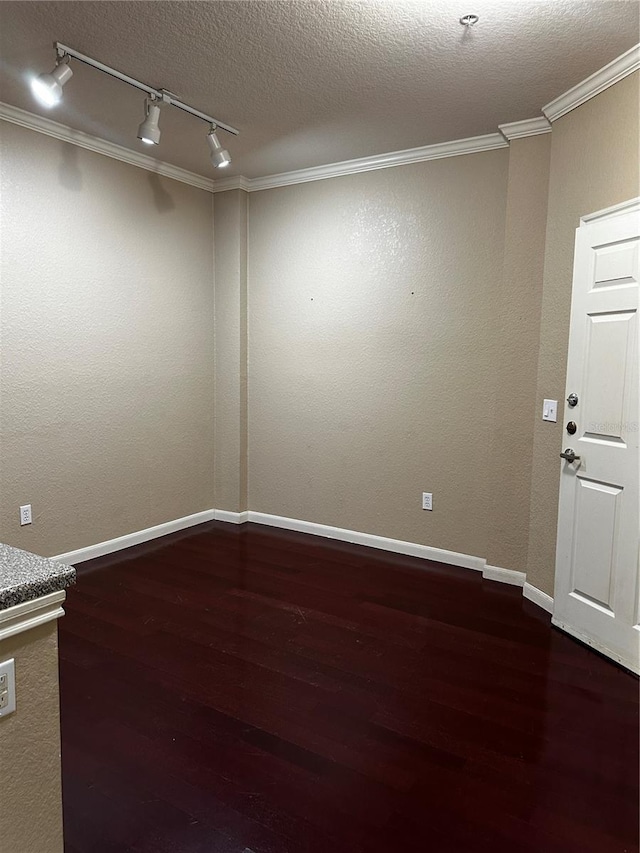 860 N Orange Ave Unit 149, Orlando, FL 32801 - spare room featuring track lighting, wood finished floors, crown molding, and a textured ceiling