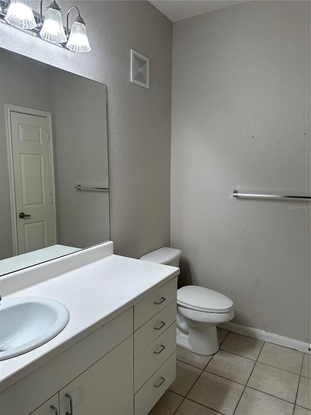 860 N Orange Ave Unit 149, Orlando, FL 32801 - half bath featuring vanity, tile patterned flooring, and a textured wall