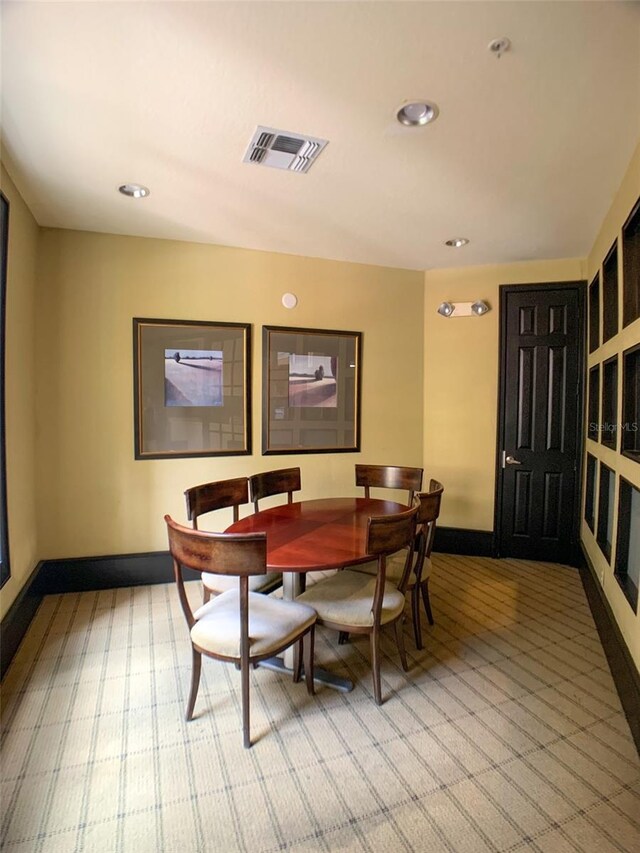 860 N Orange Ave Unit 149, Orlando, FL 32801 - dining room featuring baseboards and recessed lighting