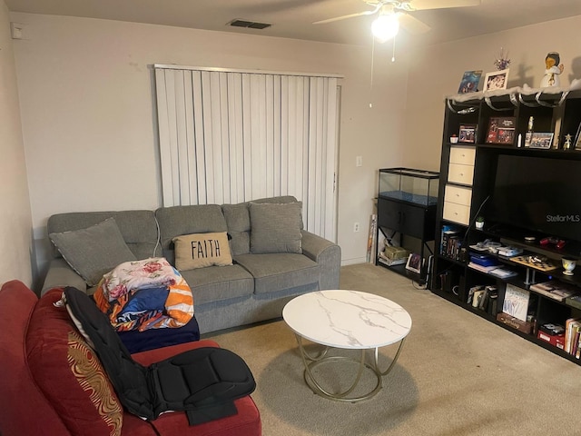 5471 Vineland Rd Unit 7108, Orlando, FL 32811 - living room with a ceiling fan, carpet floors, and visible vents