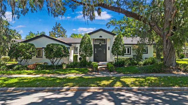 1701 Palmer Ave, Winter Park, FL 32789 - view of front of property with a tiled roof and stucco siding