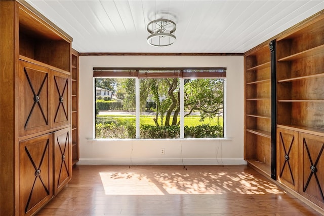 1701 Palmer Ave, Winter Park, FL 32789 - interior space featuring built in features, light wood-type flooring, baseboards, and wooden ceiling