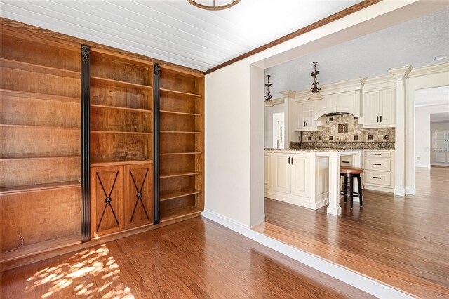 1701 Palmer Ave, Winter Park, FL 32789 - interior space with crown molding, baseboards, and wood finished floors
