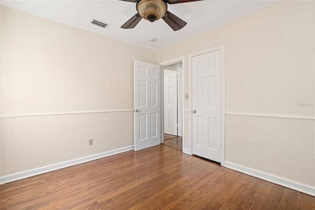 1701 Palmer Ave, Winter Park, FL 32789 - unfurnished bedroom with visible vents, baseboards, and wood finished floors