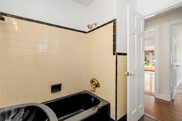 1701 Palmer Ave, Winter Park, FL 32789 - full bathroom featuring bathtub / shower combination, tile walls, and wood finished floors