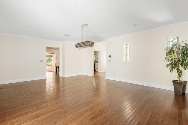 1701 Palmer Ave, Winter Park, FL 32789 - unfurnished living room with crown molding, wood finished floors, baseboards, and visible vents