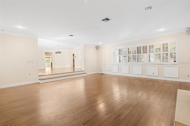 1701 Palmer Ave, Winter Park, FL 32789 - unfurnished living room featuring plenty of natural light, light wood-type flooring, and ornamental molding