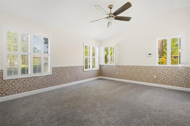 1701 Palmer Ave, Winter Park, FL 32789 - empty room featuring carpet floors, wainscoting, wallpapered walls, ceiling fan, and vaulted ceiling