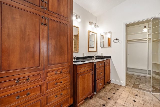 1701 Palmer Ave, Winter Park, FL 32789 - bathroom with a sink, baseboards, and double vanity