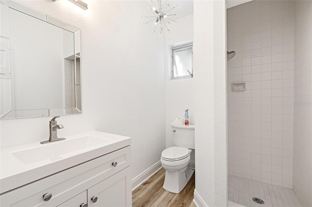 1701 Palmer Ave, Winter Park, FL 32789 - bathroom with a notable chandelier, toilet, wood finished floors, and a shower stall
