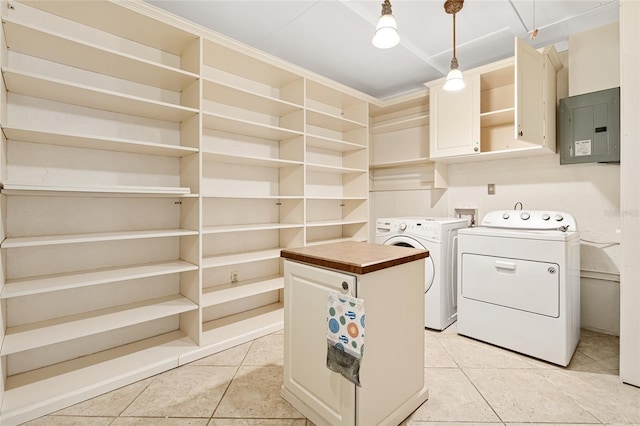 1701 Palmer Ave, Winter Park, FL 32789 - laundry area featuring electric panel, light tile patterned floors, independent washer and dryer, and cabinet space