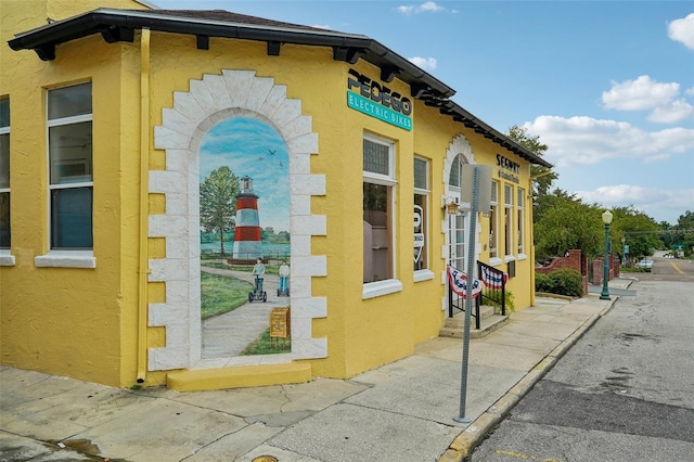 view of property exterior with stucco siding