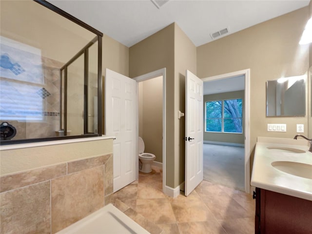 30411 Gidran Ter, Mount Dora, FL 32757 - full bathroom featuring double vanity, a stall shower, visible vents, and a sink