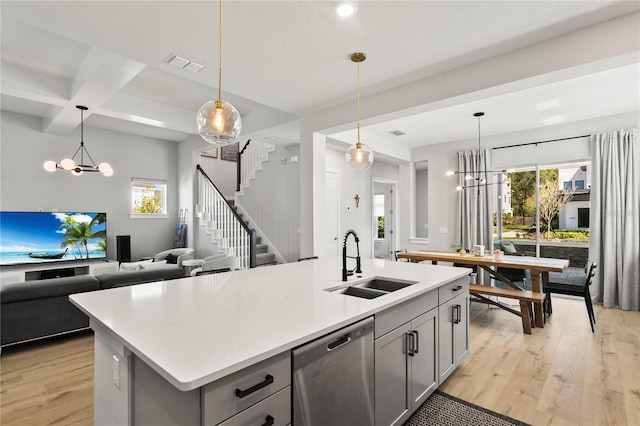 14004 Gullstrand Ave, Orlando, FL 32827 - kitchen featuring dishwasher, gray cabinets, a sink, and a notable chandelier