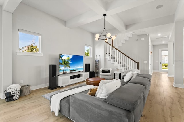 14004 Gullstrand Ave, Orlando, FL 32827 - living room with baseboards, stairs, light wood-style floors, and beam ceiling