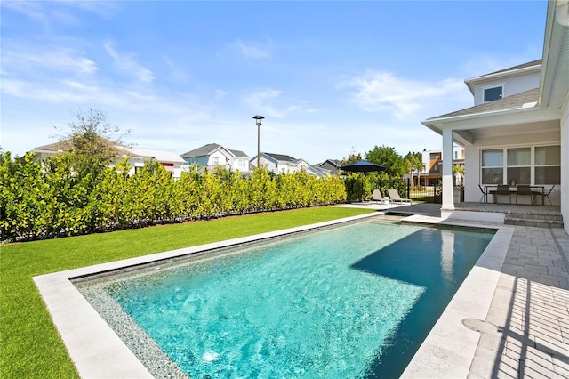 14004 Gullstrand Ave, Orlando, FL 32827 - view of swimming pool with a patio, fence, a fenced in pool, and a lawn