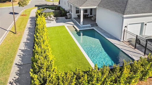 14004 Gullstrand Ave, Orlando, FL 32827 - view of pool featuring a patio, fence, a lawn, and a fenced in pool