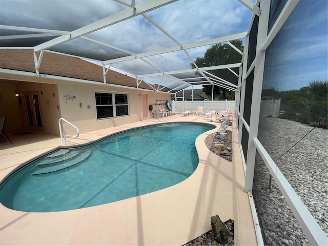 view of pool featuring a patio, fence, and a fenced in pool