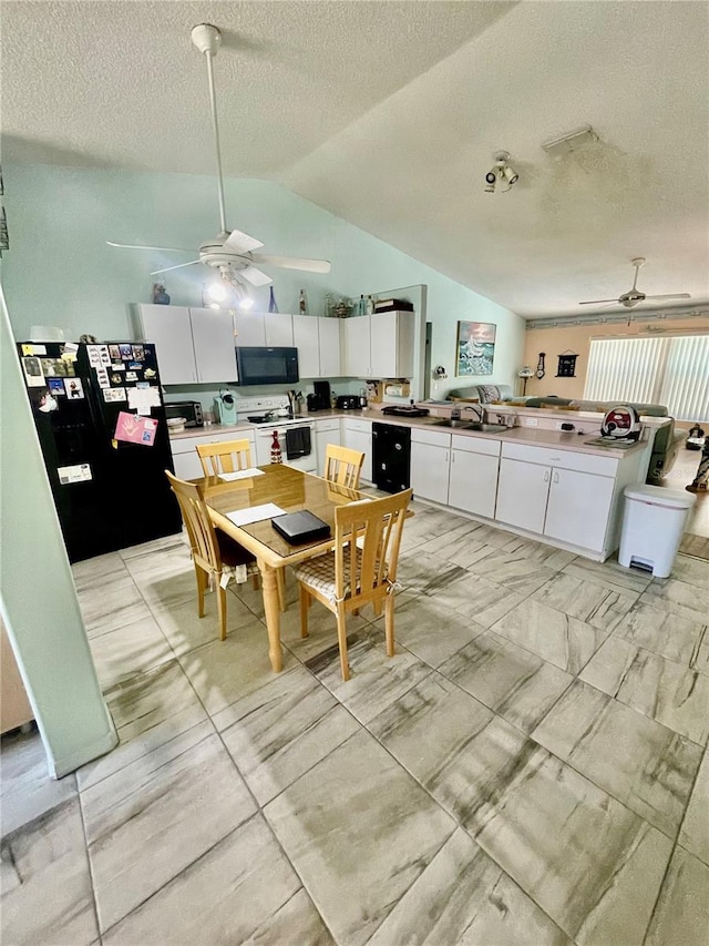 6037 Hickory Grove Ln, Port Orange, FL 32128 - dining room featuring a ceiling fan, vaulted ceiling, a textured ceiling, and light marble finish floors