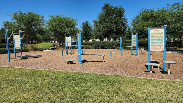 community jungle gym featuring a lawn