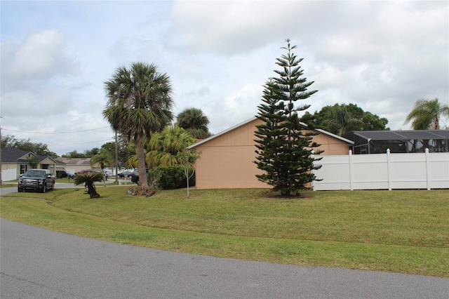 855 San Pedro Ct, Kissimmee, FL 34758 - view of side of property featuring a lawn and fence