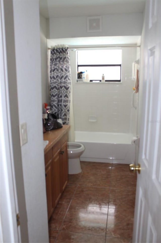 855 San Pedro Ct, Kissimmee, FL 34758 - bathroom with visible vents, toilet, vanity, shower / tub combo, and tile patterned flooring
