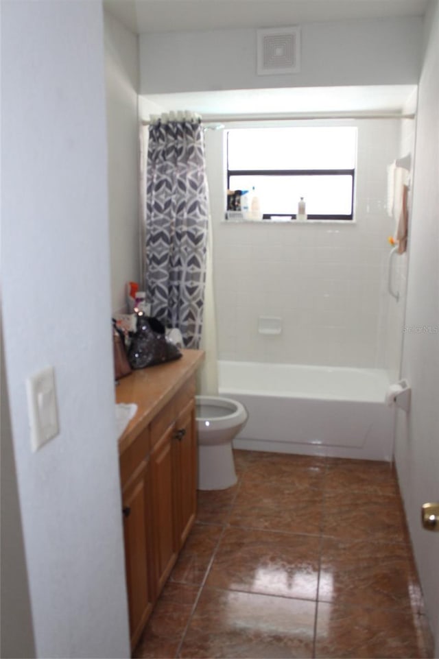855 San Pedro Ct, Kissimmee, FL 34758 - bathroom featuring shower / bath combination with curtain, toilet, vanity, and visible vents