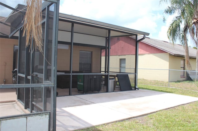 855 San Pedro Ct, Kissimmee, FL 34758 - back of house with glass enclosure, fence, and a patio