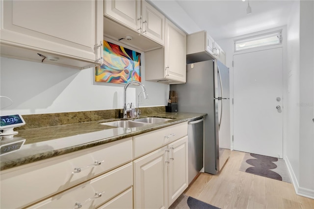700 Melrose Ave Unit L-23, Winter Park, FL 32789 - kitchen with a sink, stone counters, white cabinets, and dishwasher