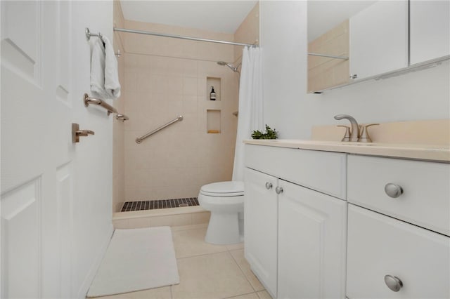 700 Melrose Ave Unit L-23, Winter Park, FL 32789 - full bathroom with a tile shower, toilet, tile patterned flooring, and vanity