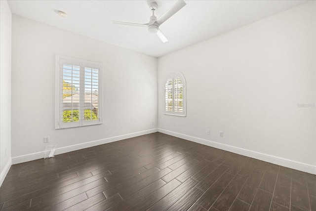 unfurnished room featuring dark wood-type flooring, baseboards, and ceiling fan