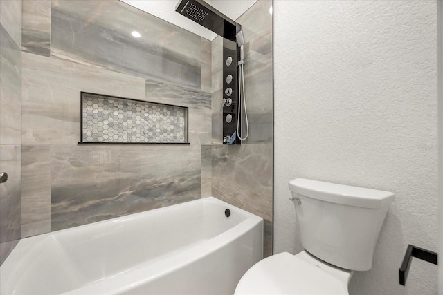 bathroom featuring toilet, a tub to relax in, a textured wall, and walk in shower