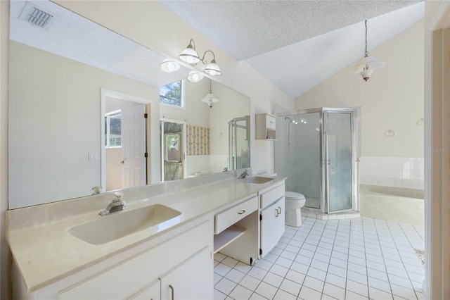 bathroom with visible vents, a shower stall, a sink, and tile patterned flooring