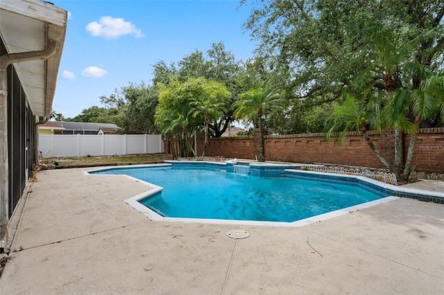 view of swimming pool with a patio, a fenced in pool, and a fenced backyard